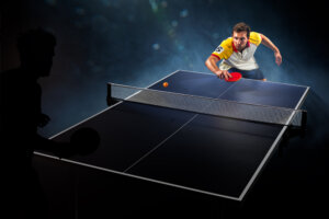Young,Sports,Man,Tennis,Player,Is,Playing,On,Black,Background