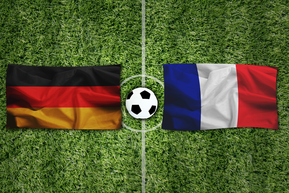 Germany,Flag,Vs,Frace,Flag,And,Ball,On,Green,Grass.