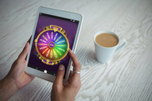 Multi,Colored,Fortune,Of,Wheel,On,Mobile,Display,Against,Cropped